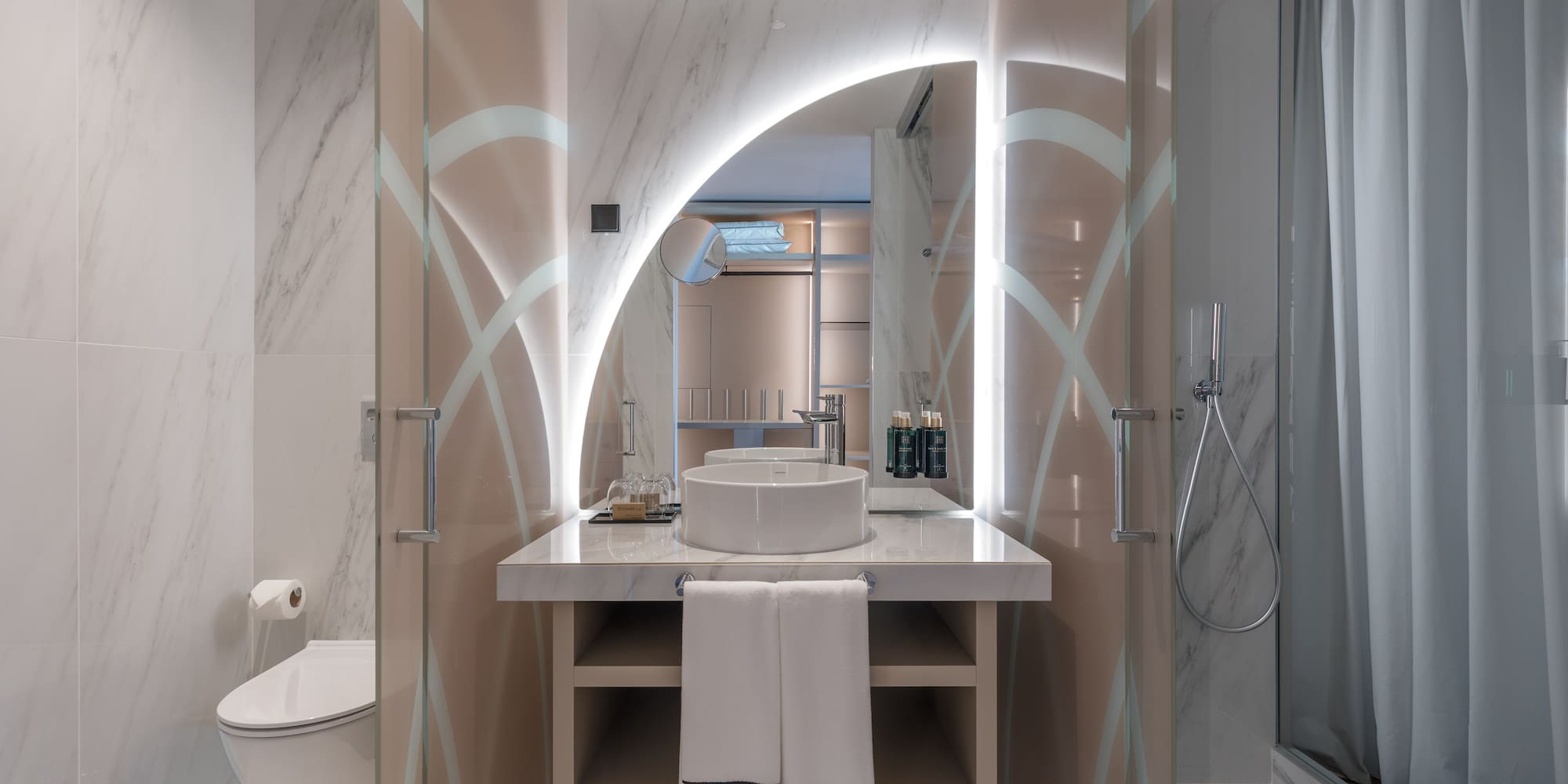 a bathroom with a sink and shower