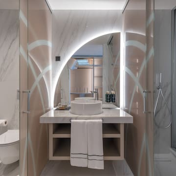 a bathroom with a sink and shower