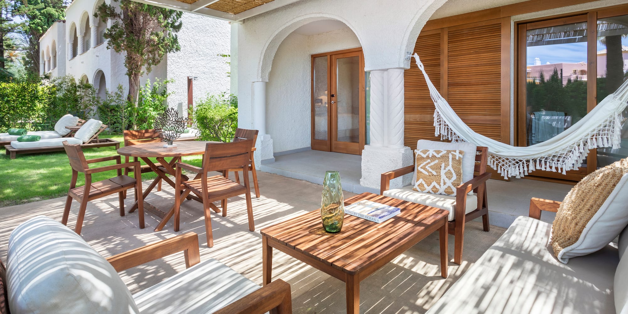 a patio with chairs and tables