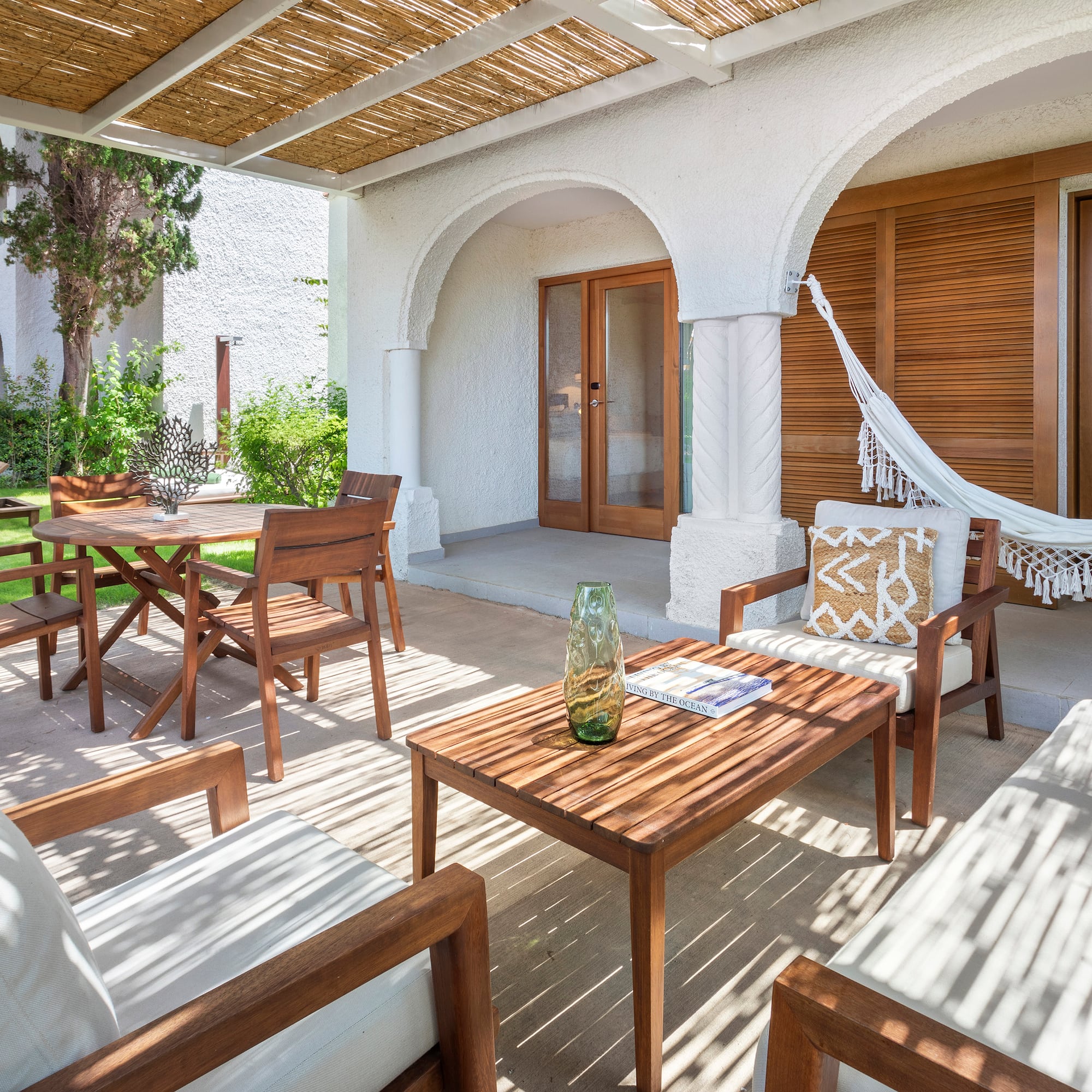 a patio with chairs and tables