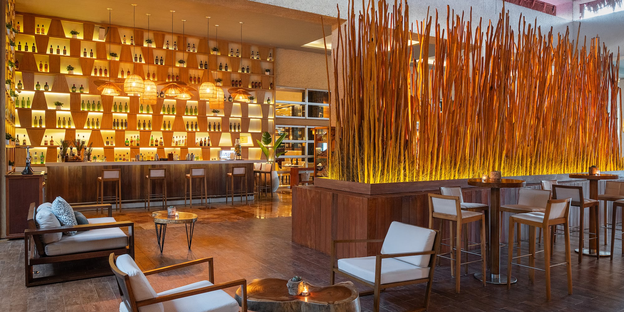 a room with a bar and chairs