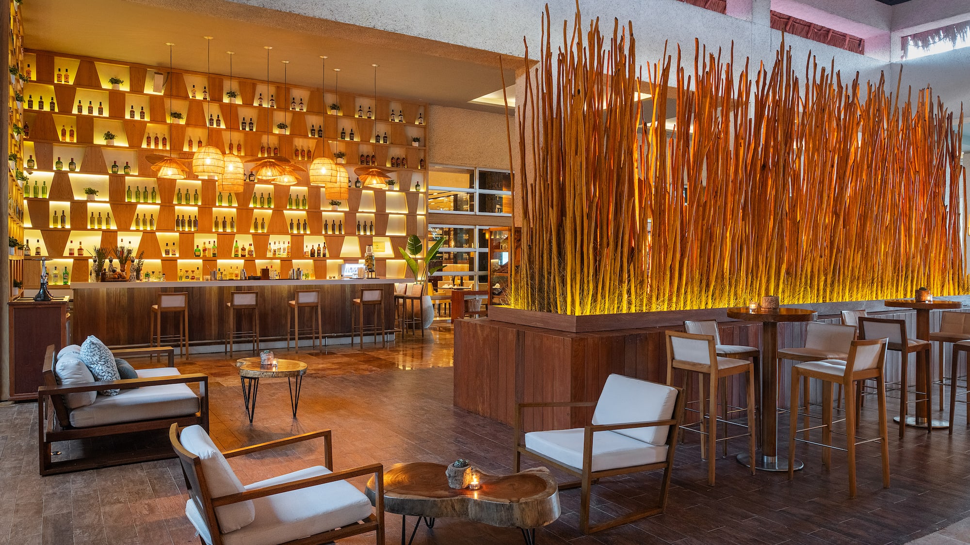 a room with a bar and chairs