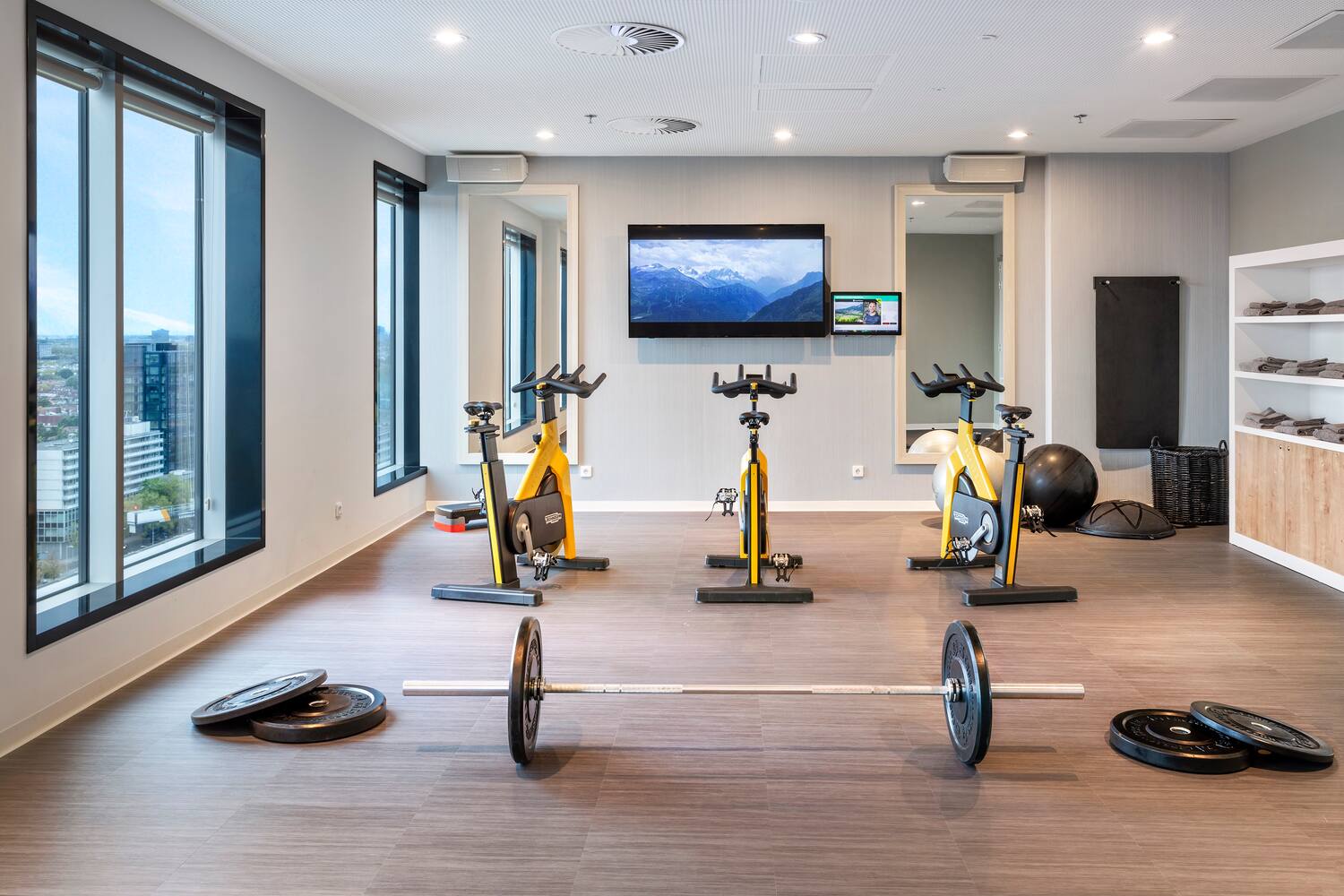 a room with exercise bikes and weights