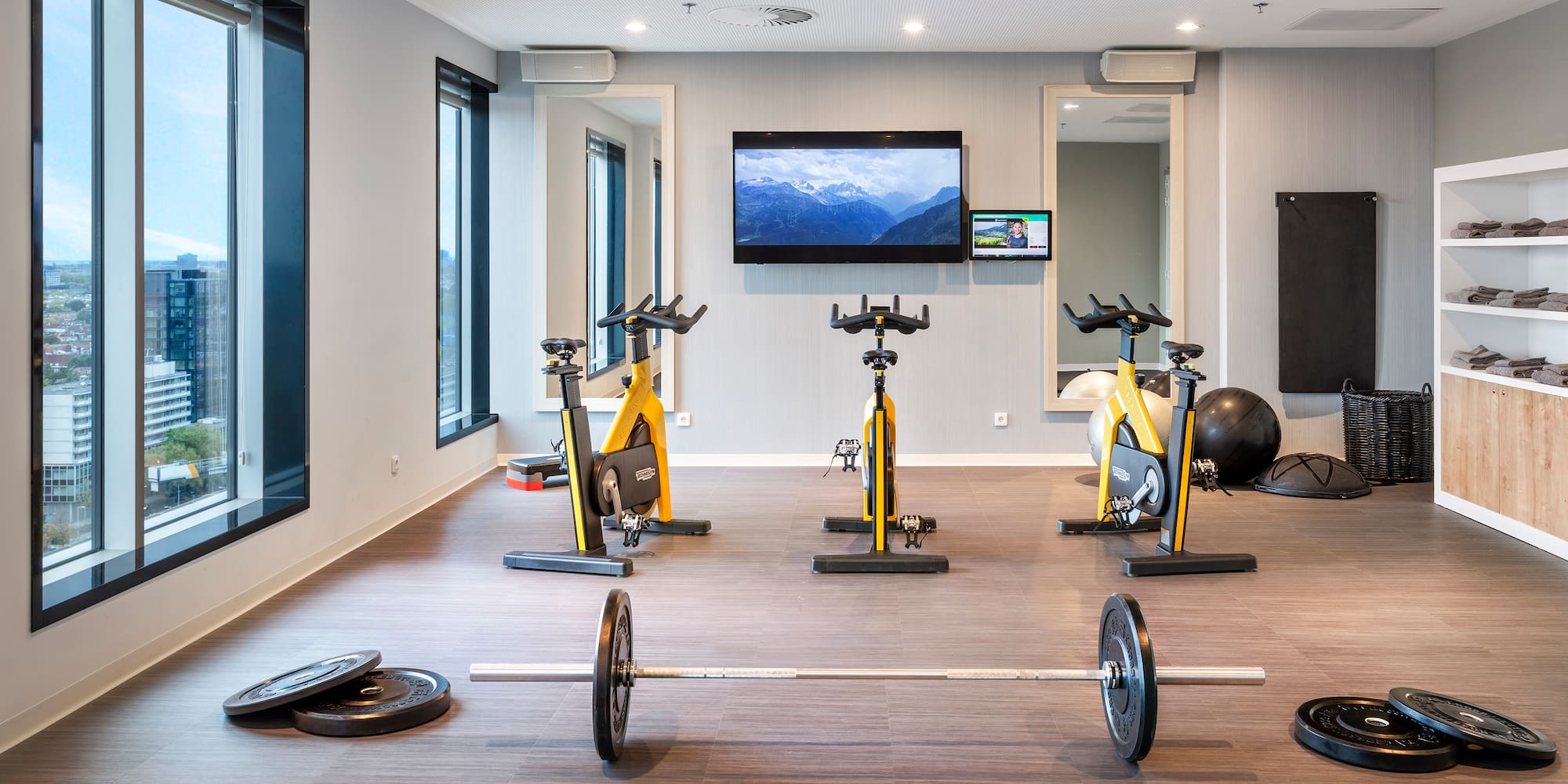a room with exercise bikes and weights