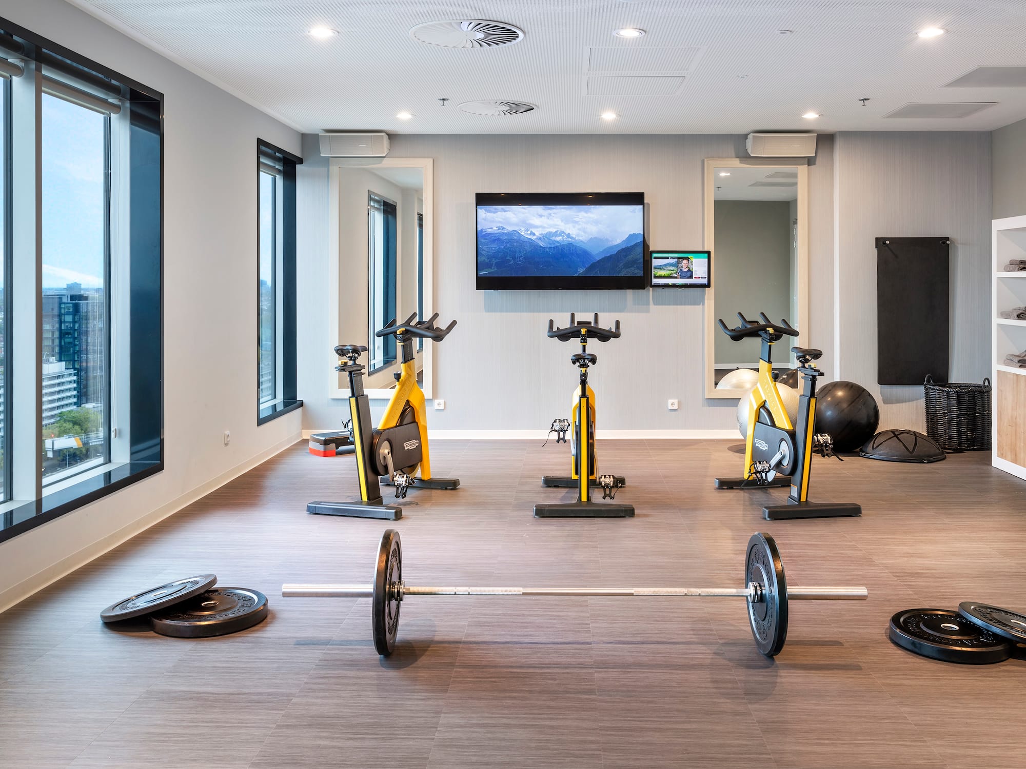 a room with exercise bikes and weights