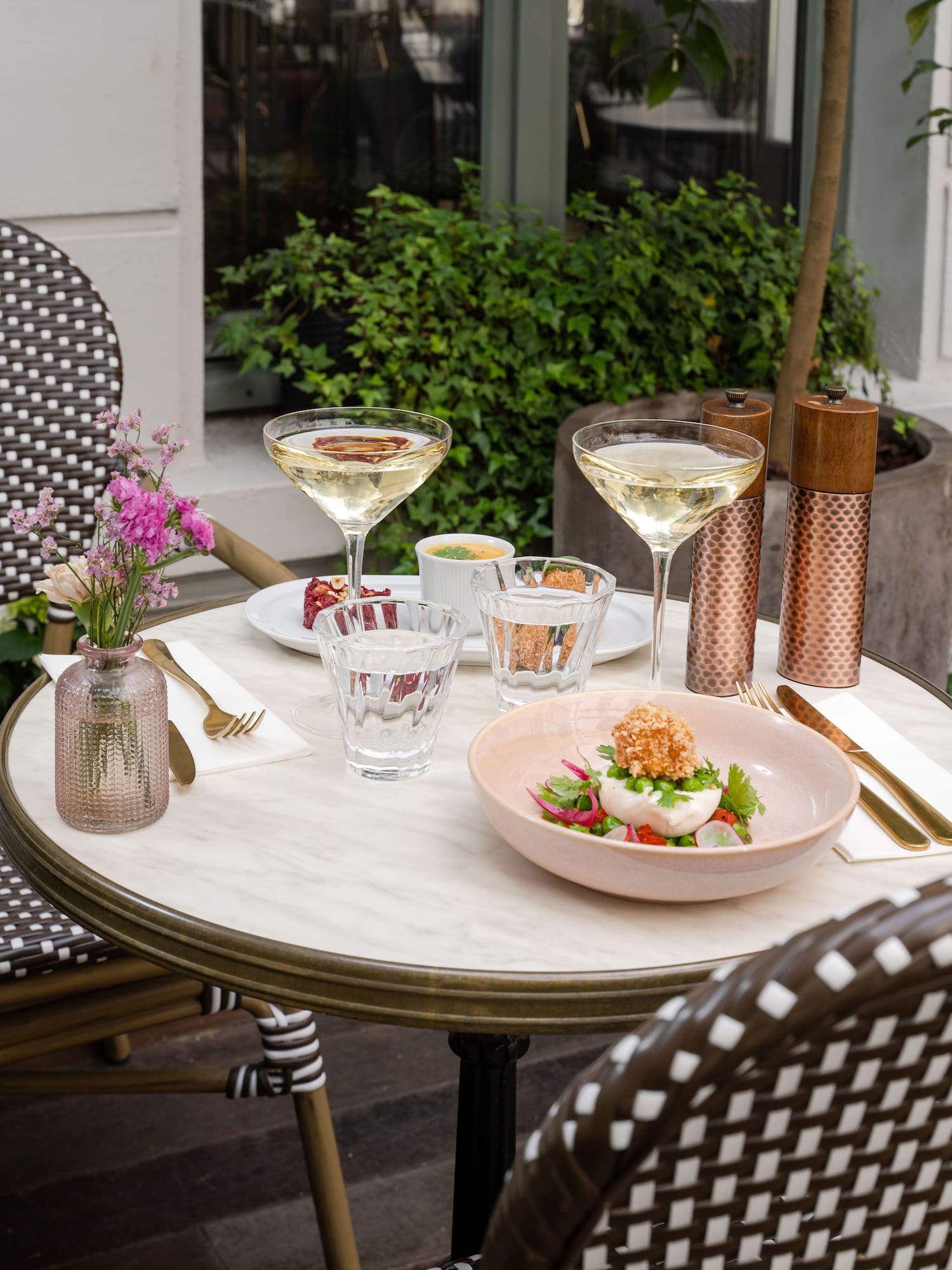 a table with glasses and food on it