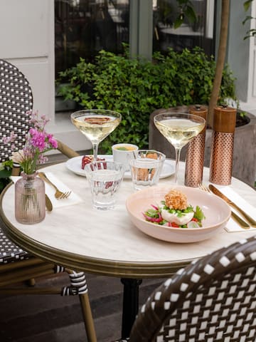 a table with glasses and food on it