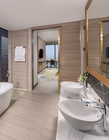 a bathroom with a tub and sink