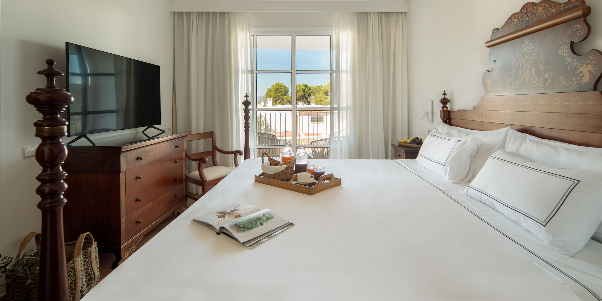 a bed with a tray of food on it