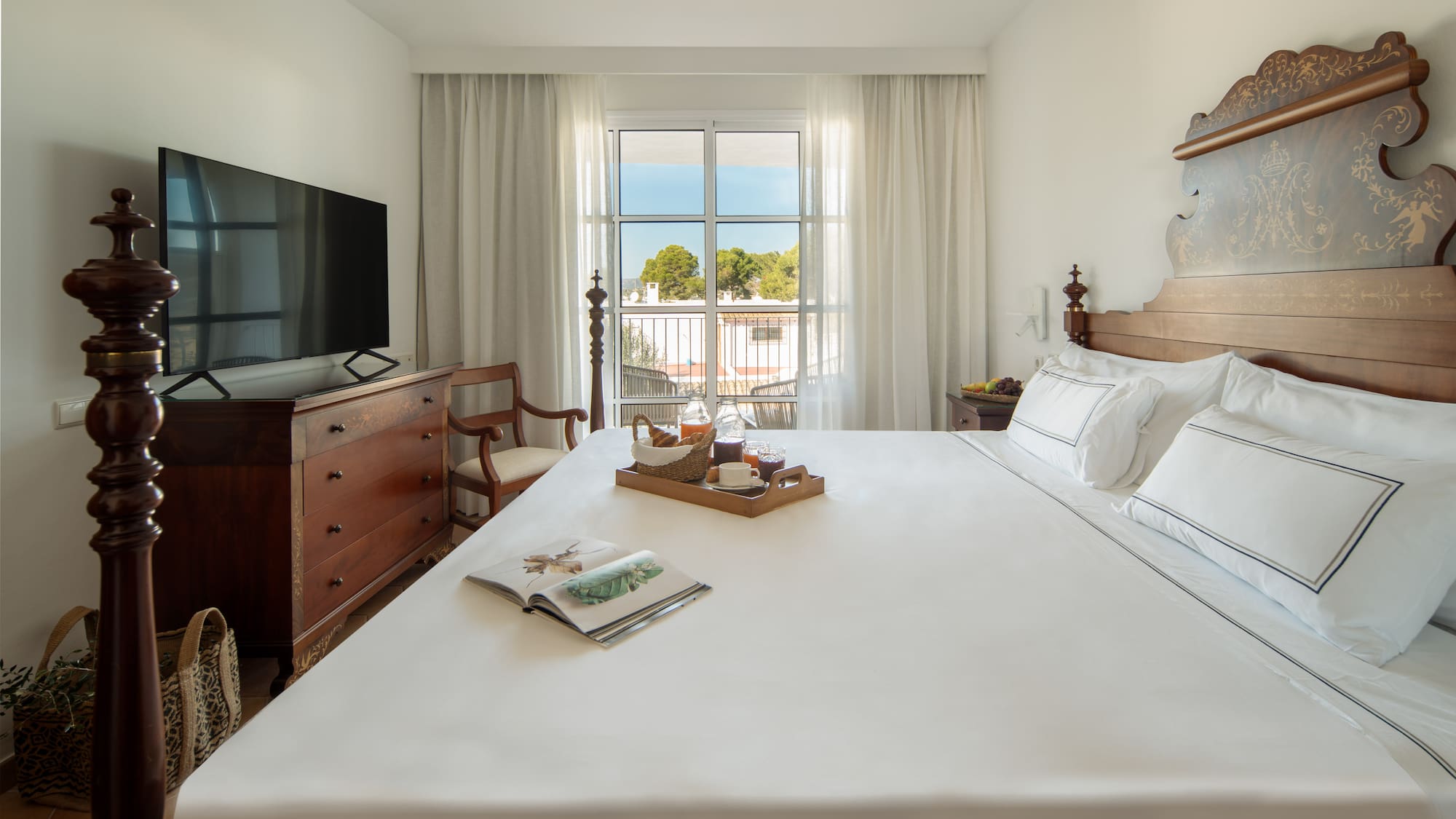 a bed with a tray of food on it