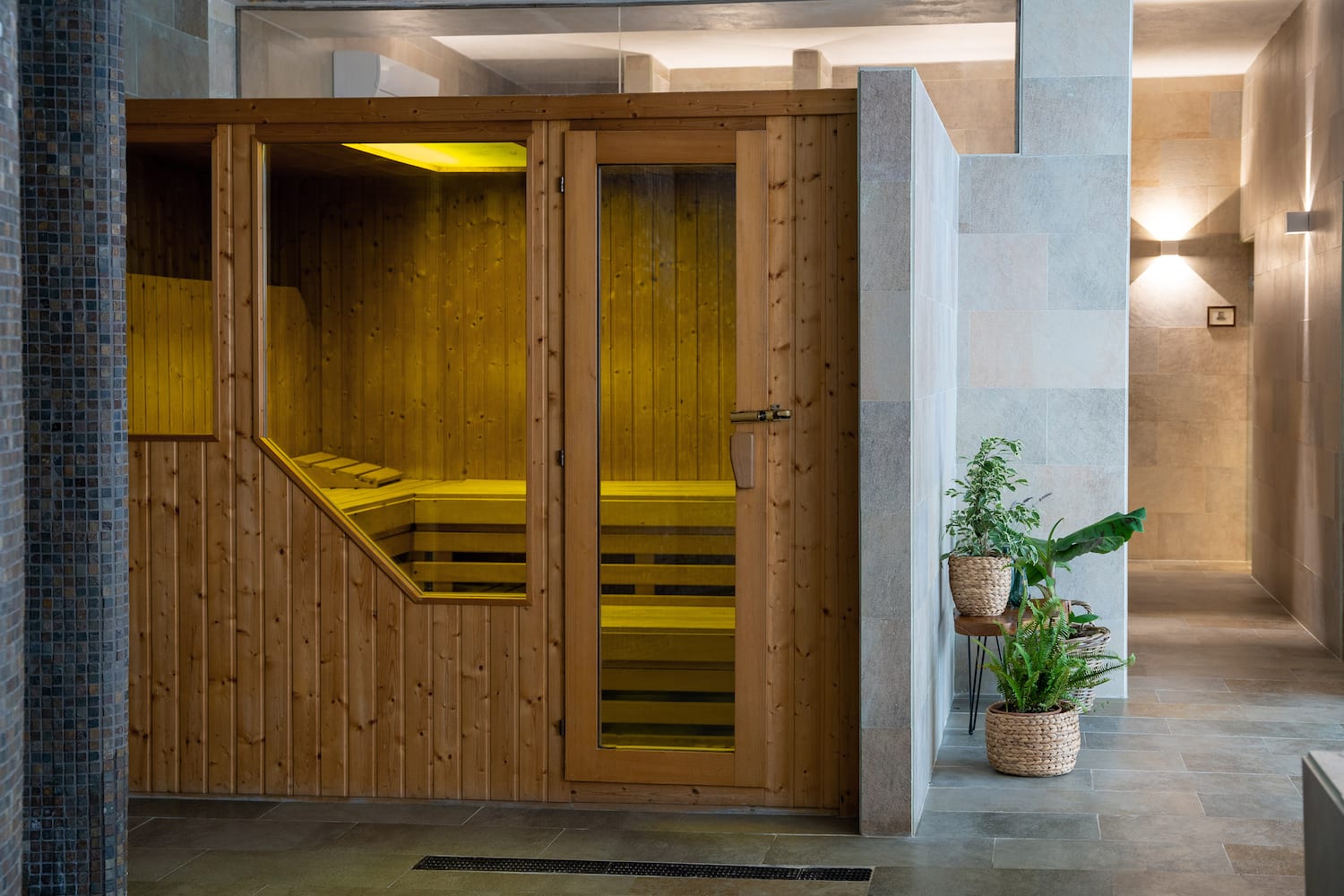 a wooden sauna door with glass doors