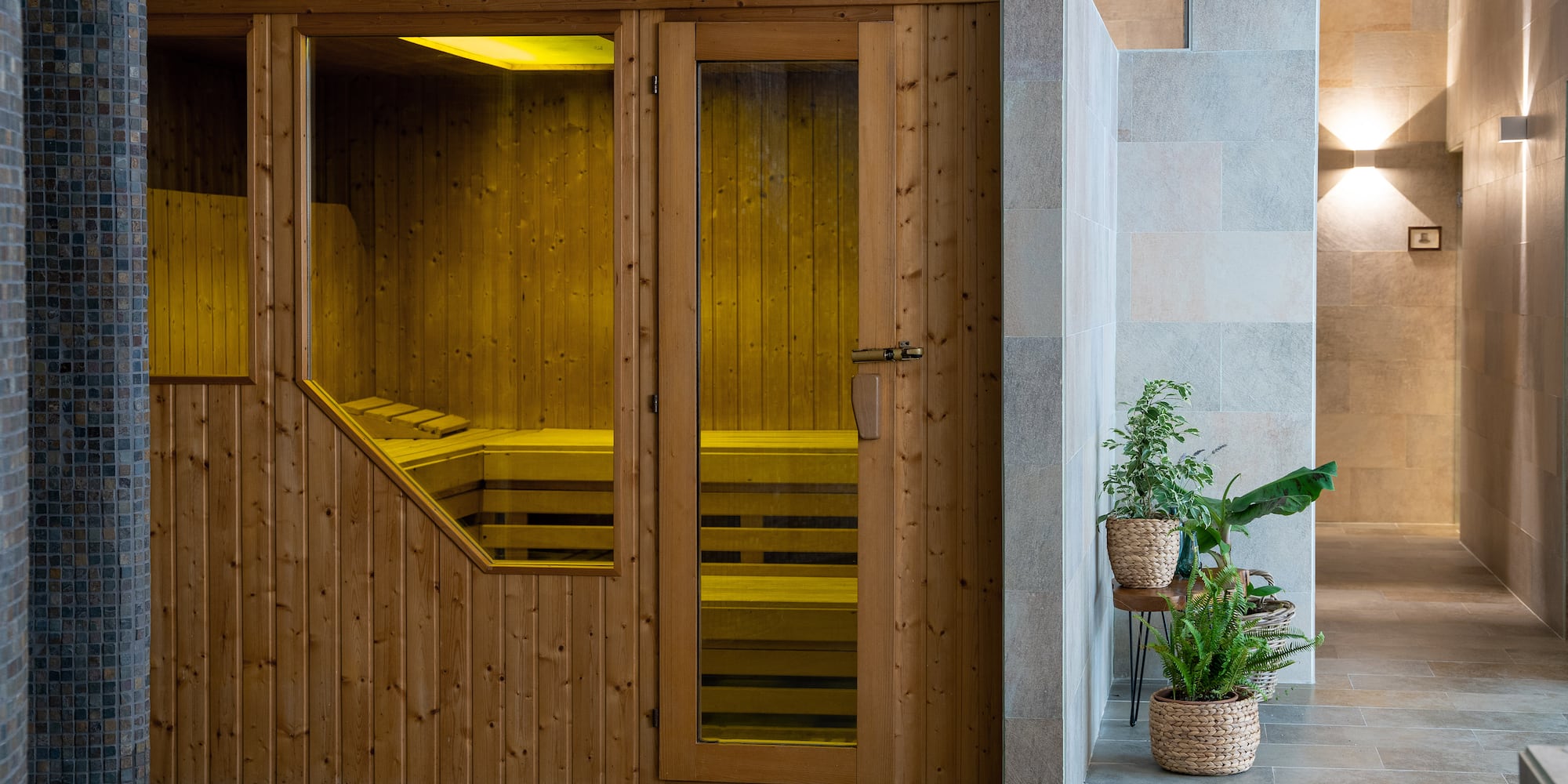 a wooden sauna door with glass doors