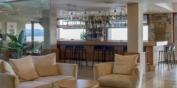 a room with a bar and a couch and a table