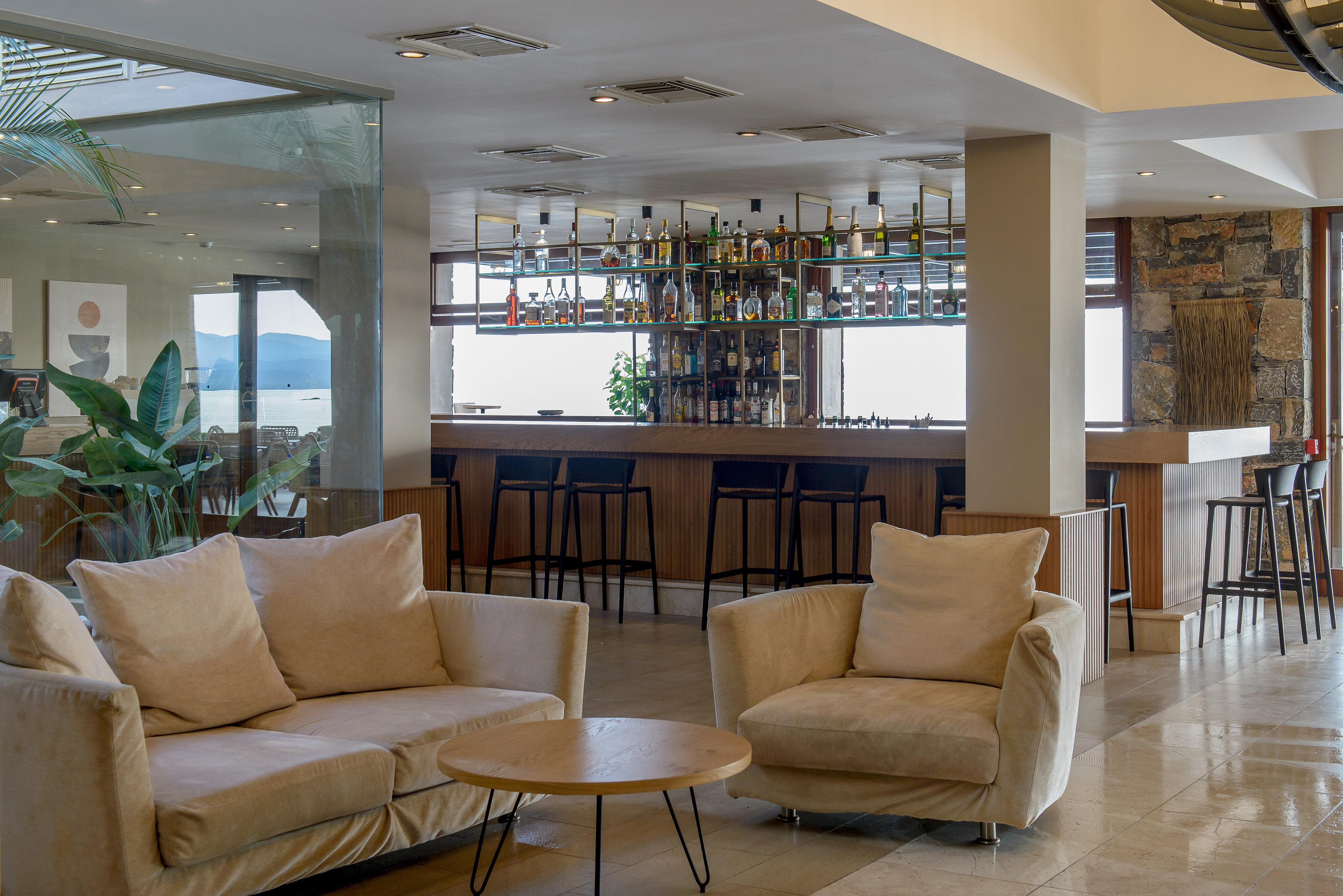 a room with a bar and a couch and a table