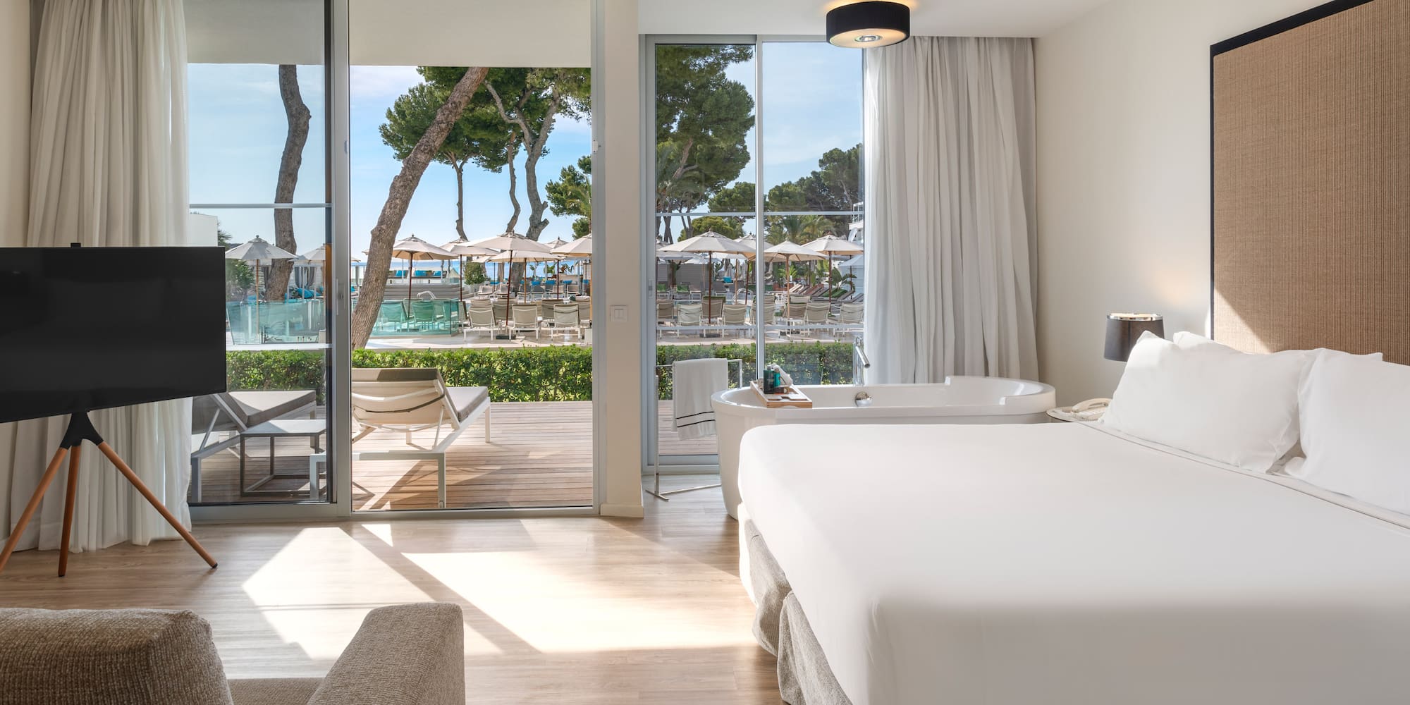 a room with a bed and a tub