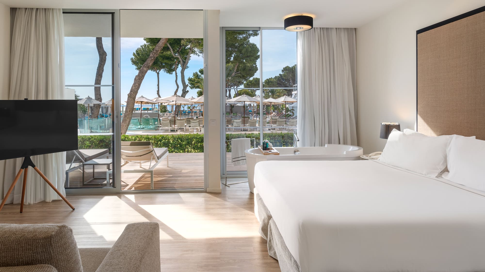 a room with a bed and a tub