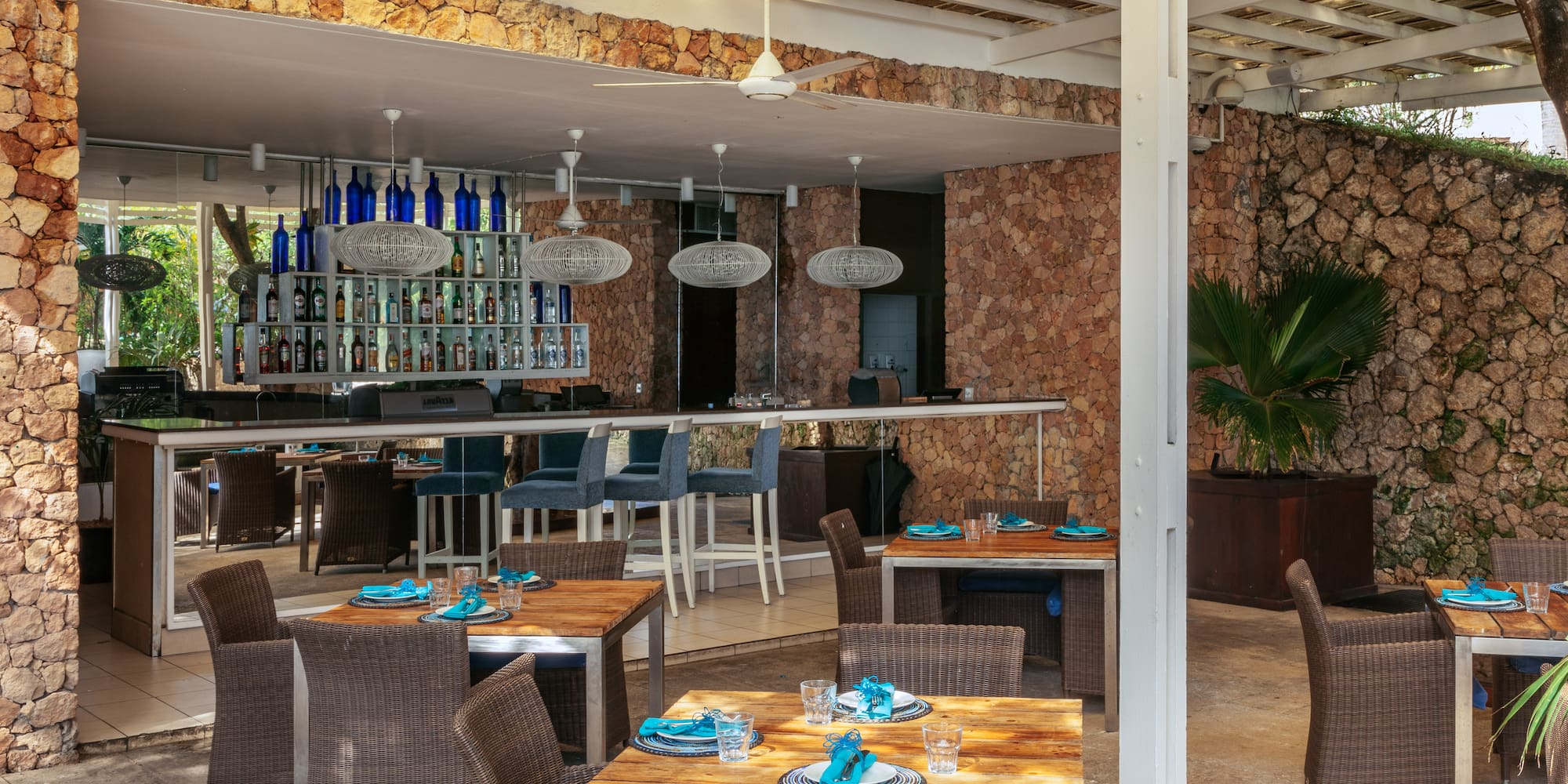 a patio with tables and chairs