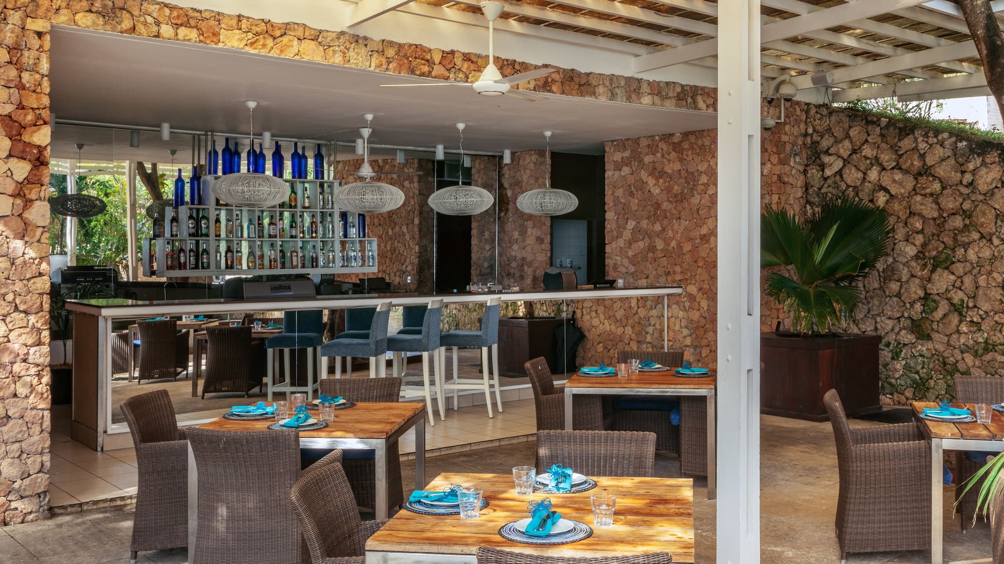 a patio with tables and chairs