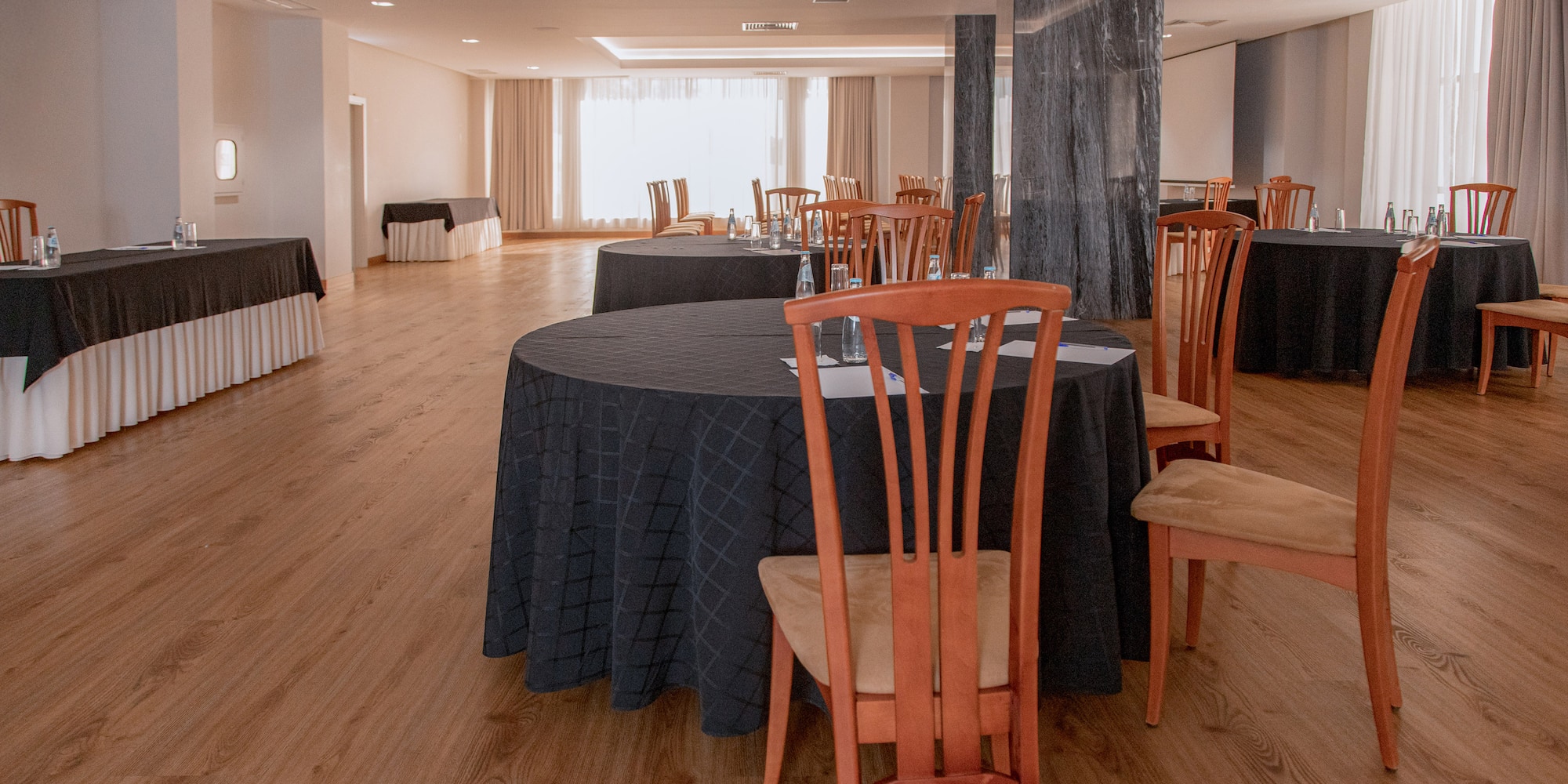 a room with tables and chairs