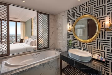 a bathroom with a bathtub and a mirror