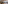 Modern gym with Technogym equipment, wood floor, mirrors, and natural light.