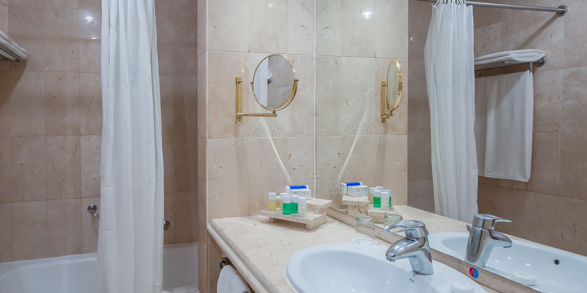 a bathroom with a sink and shower curtain
