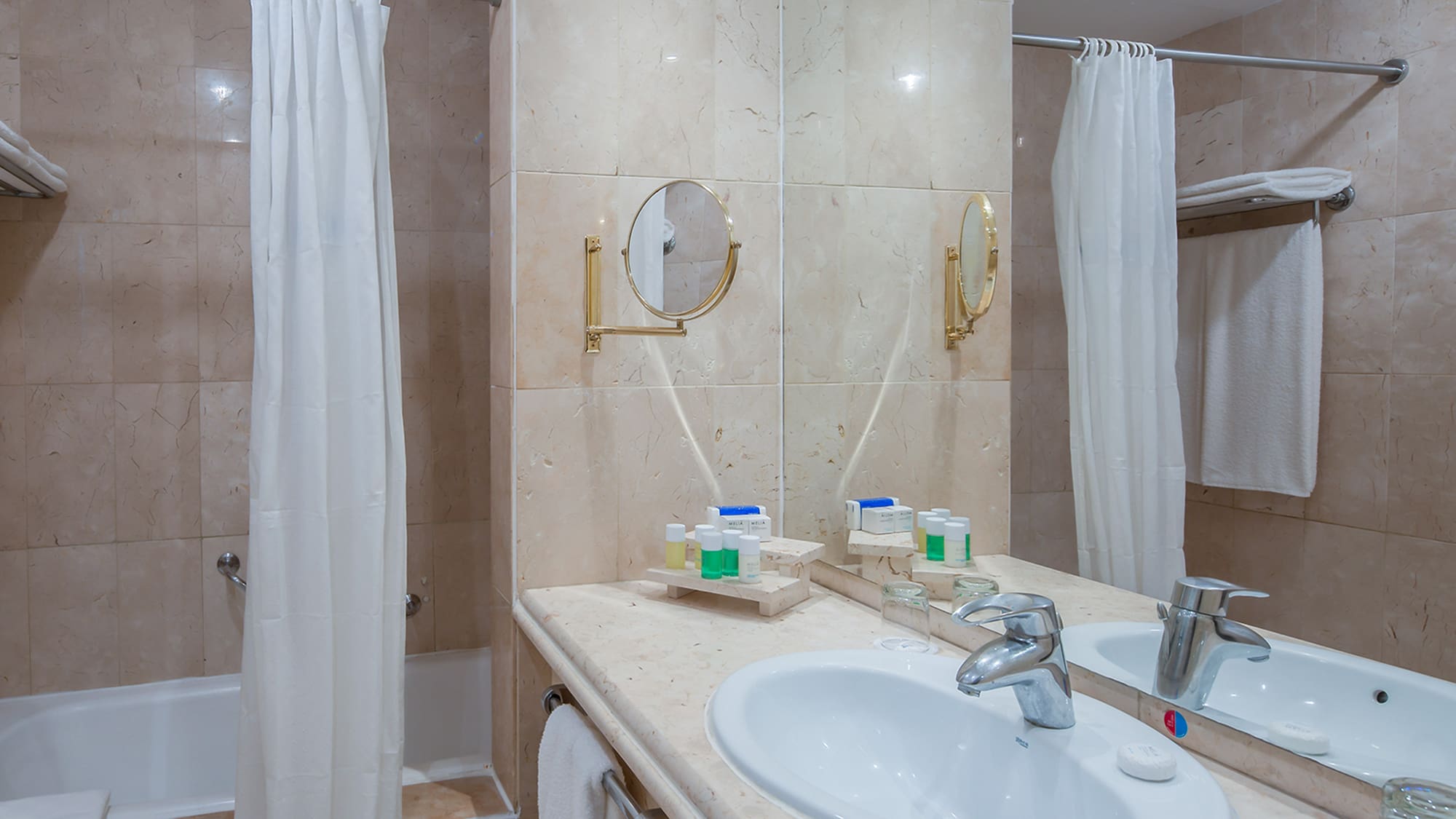 a bathroom with a sink and shower curtain