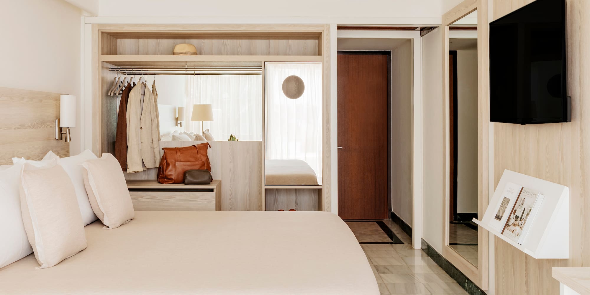 a bedroom with a bed and a mirror