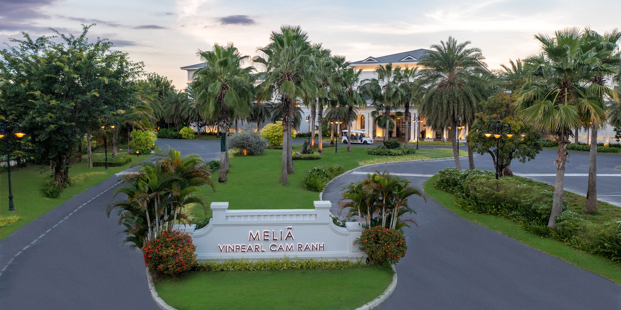 a palm trees and a sign in front of a building