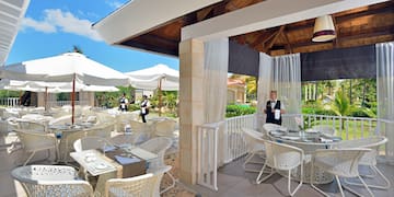 a restaurant with tables and chairs