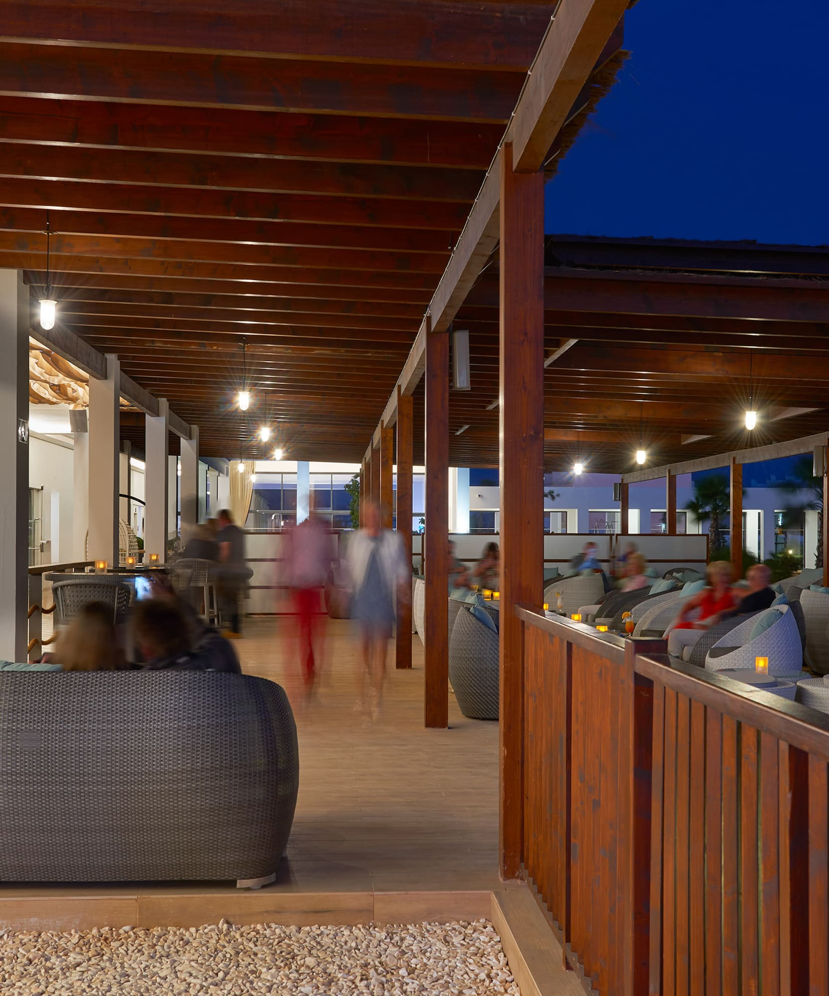 a group of people sitting in a patio