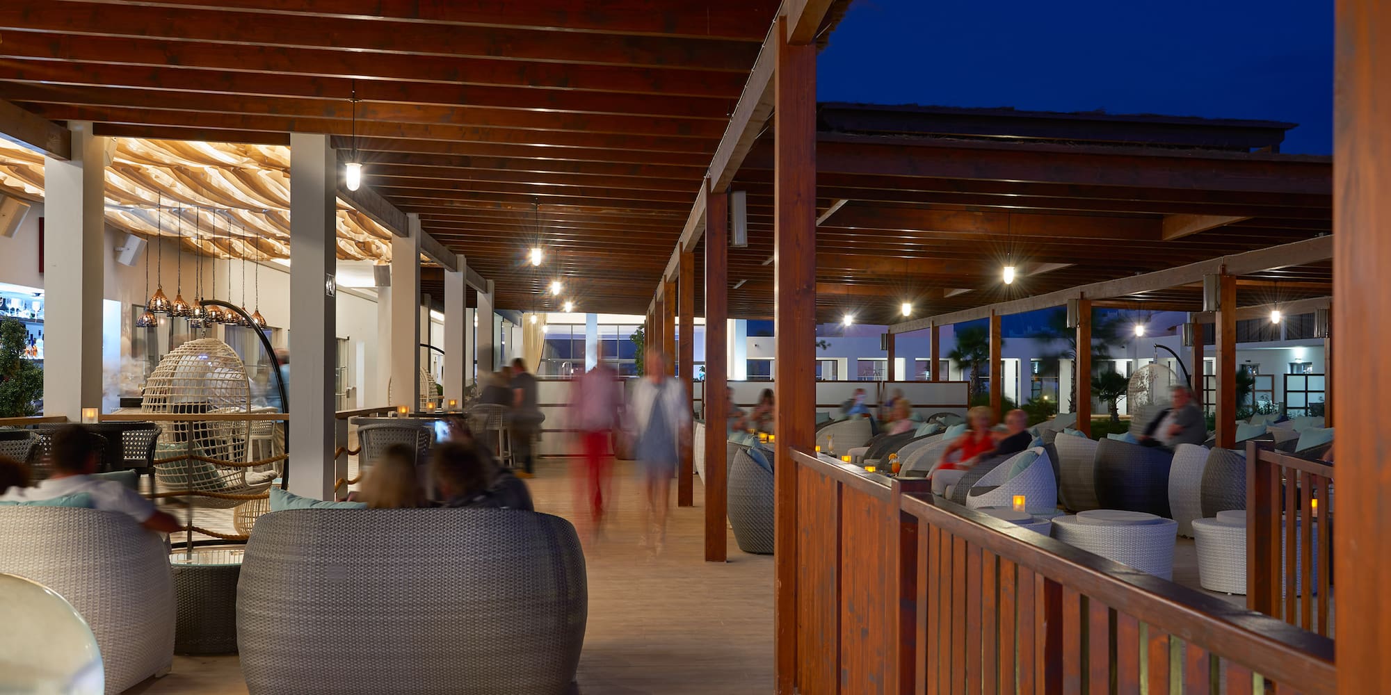 a group of people sitting in a patio