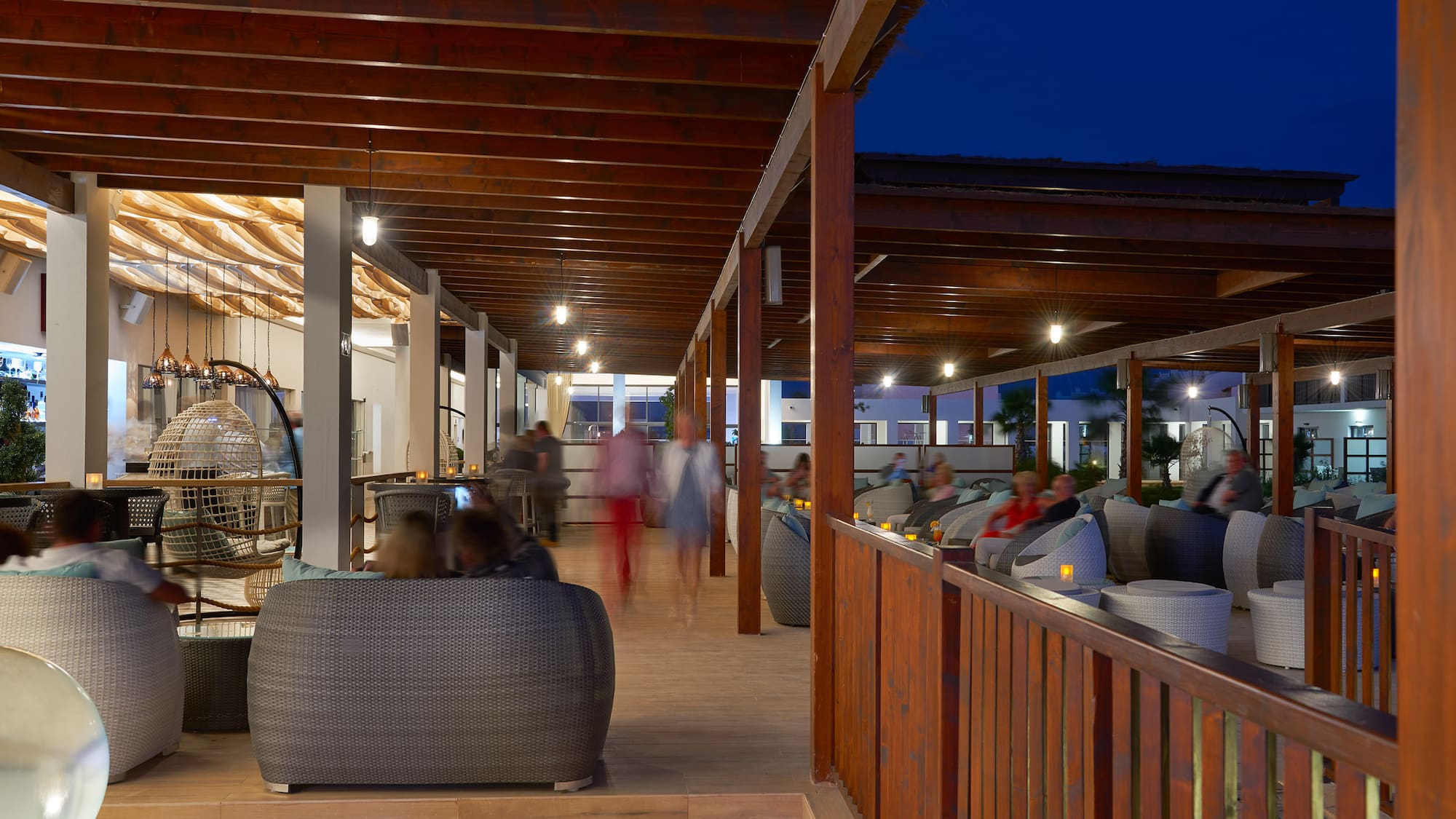 a group of people sitting in a patio