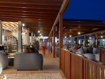 a group of people sitting in a patio
