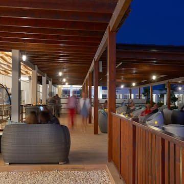 a group of people sitting in a patio