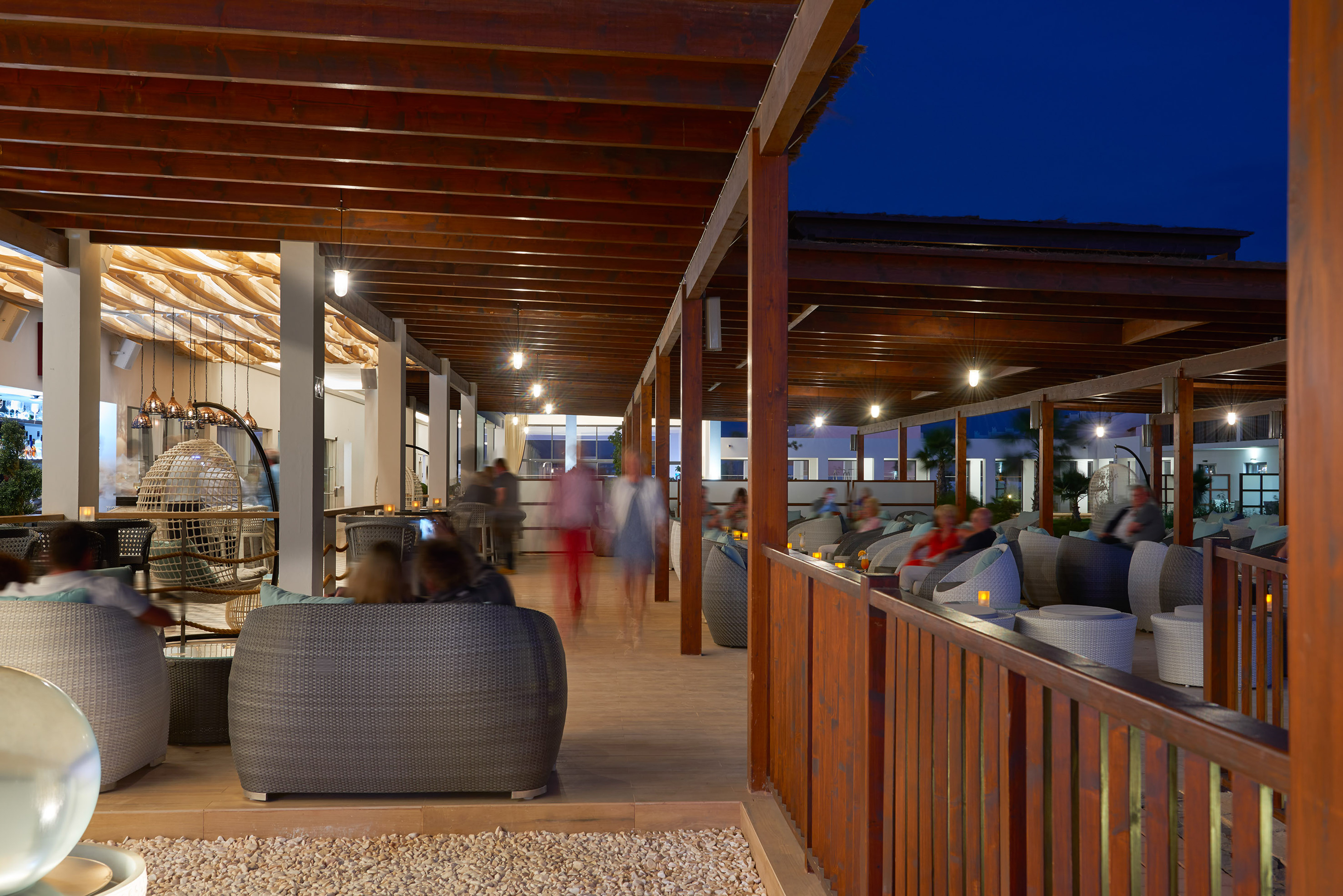 a group of people sitting in a patio