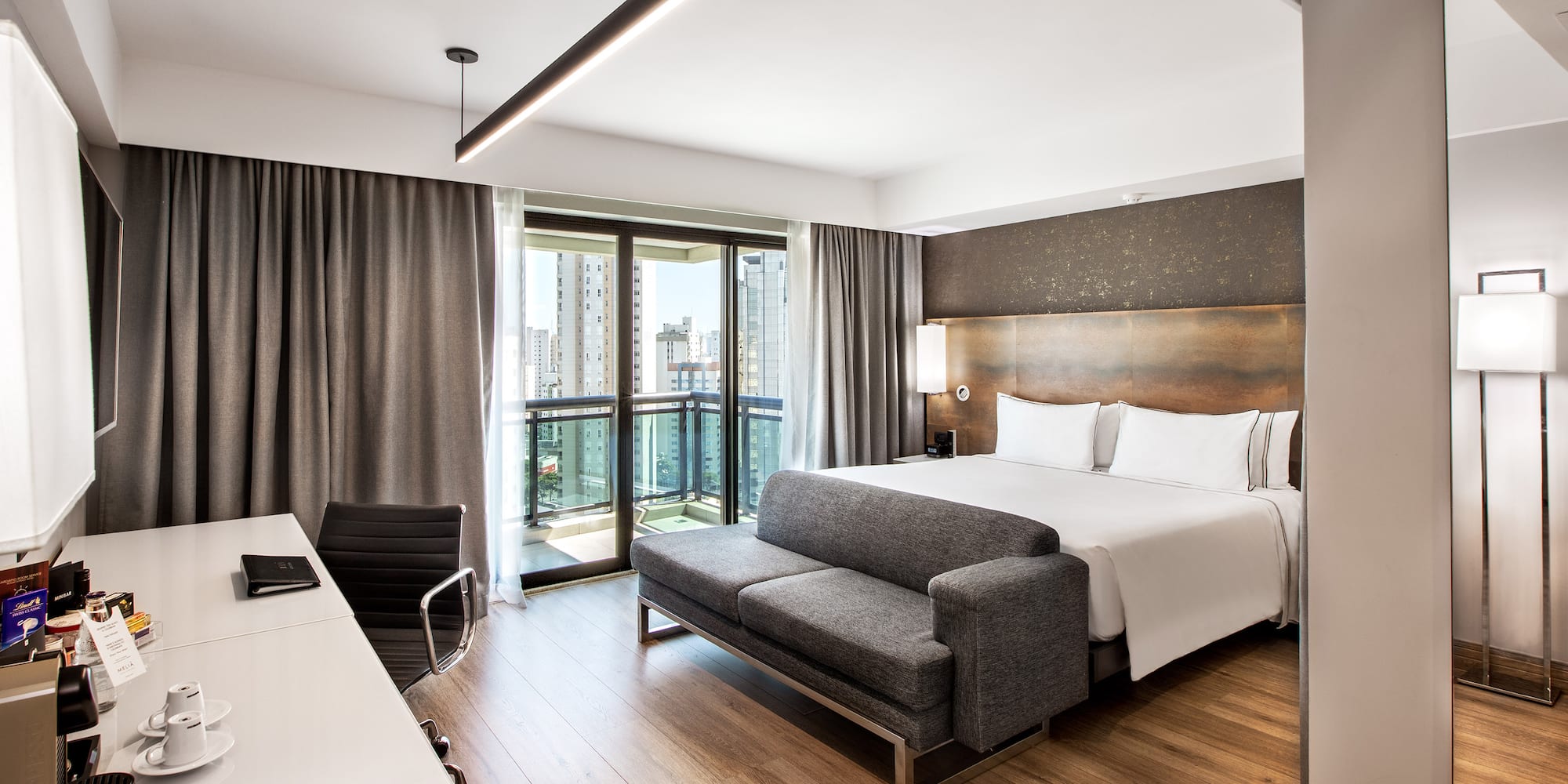 a room with a bed and a desk