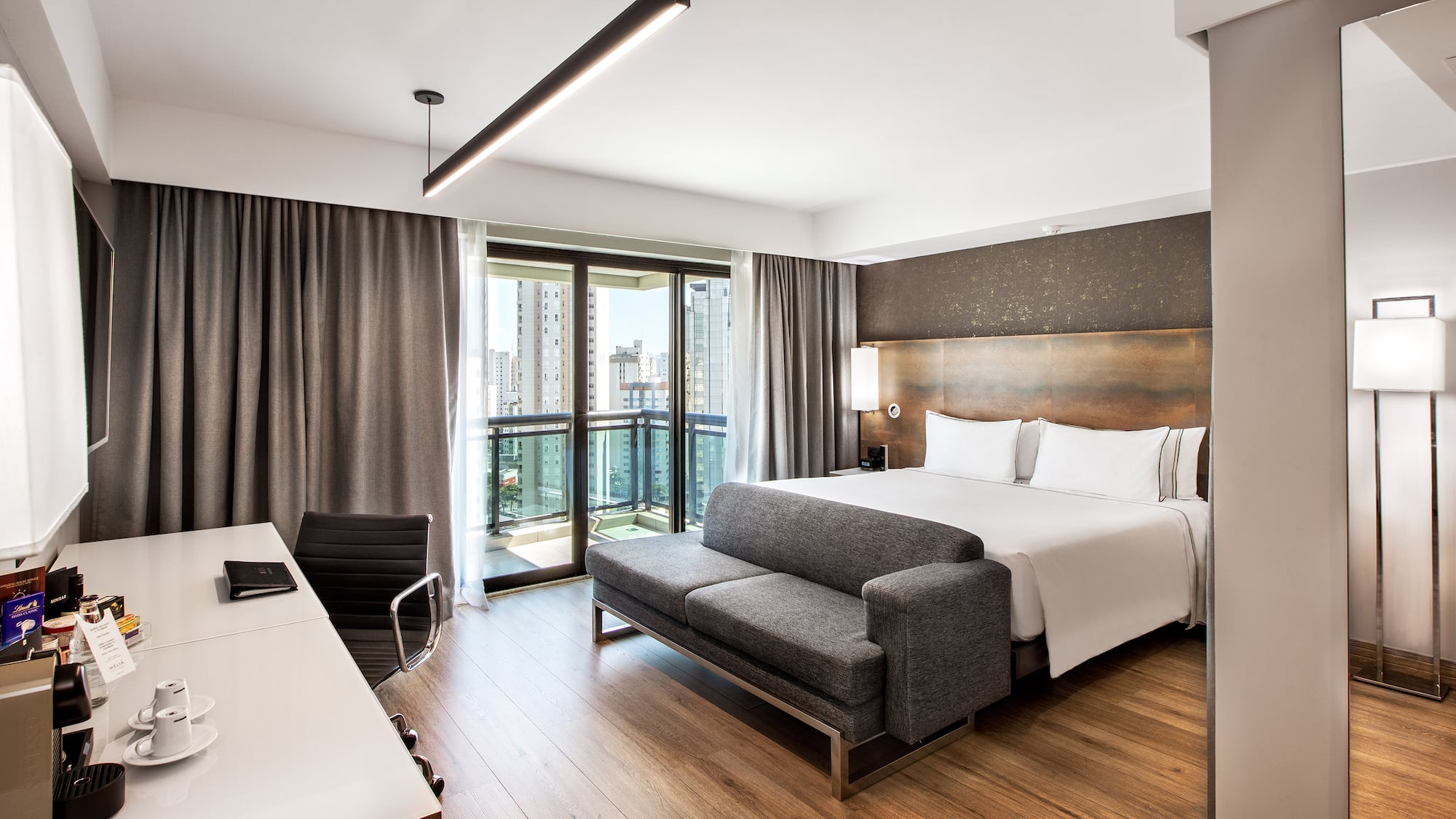 a room with a bed and a desk