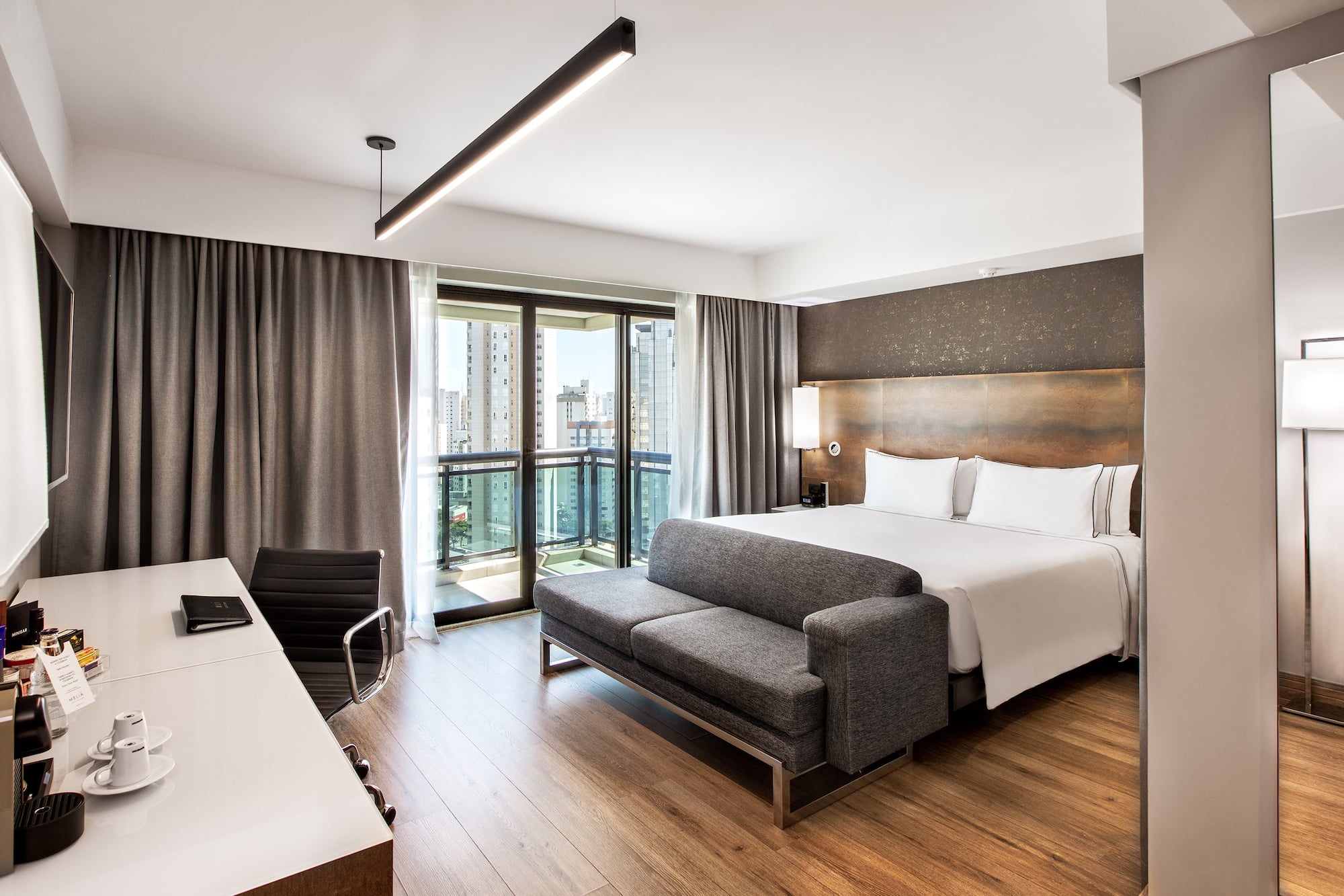 a room with a bed and a desk