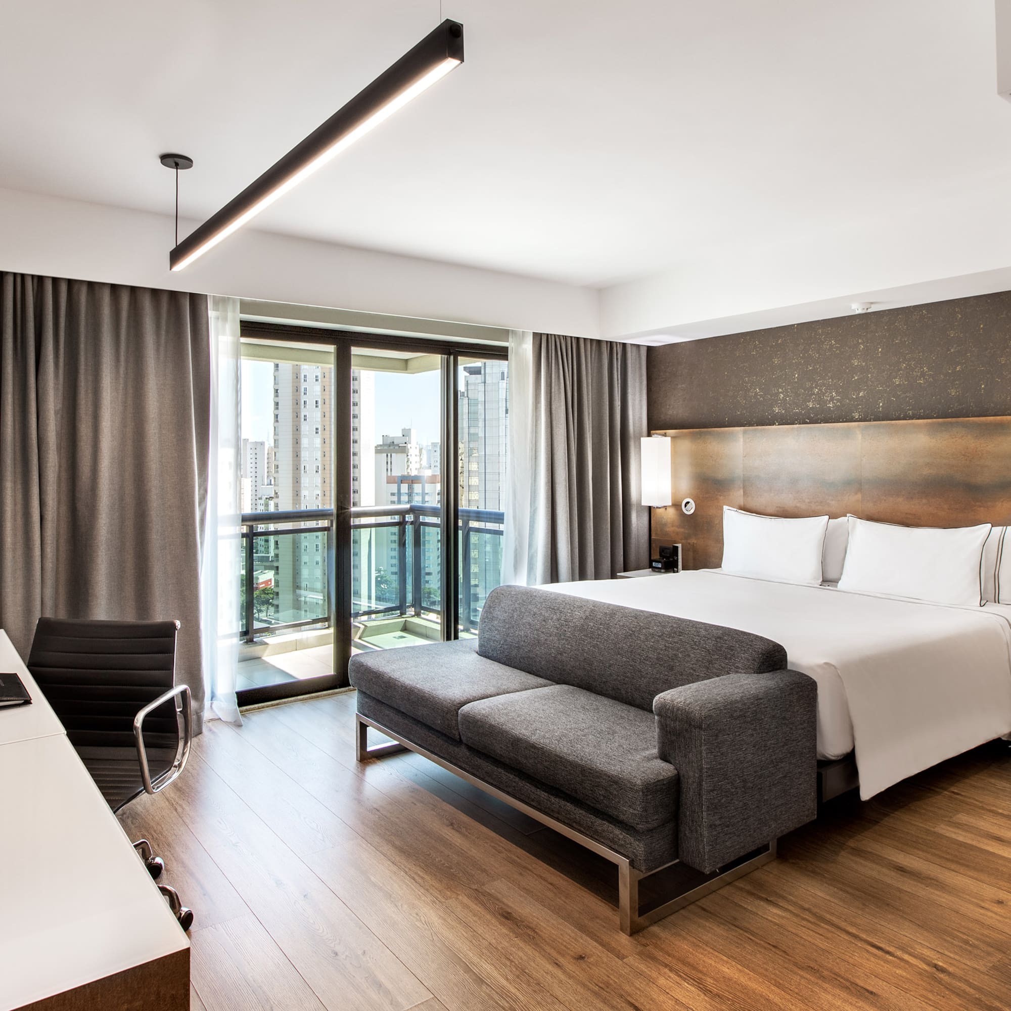 a room with a bed and a desk