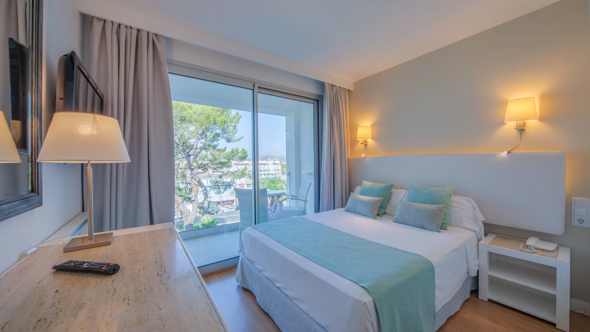 a bedroom with a desk and a bed