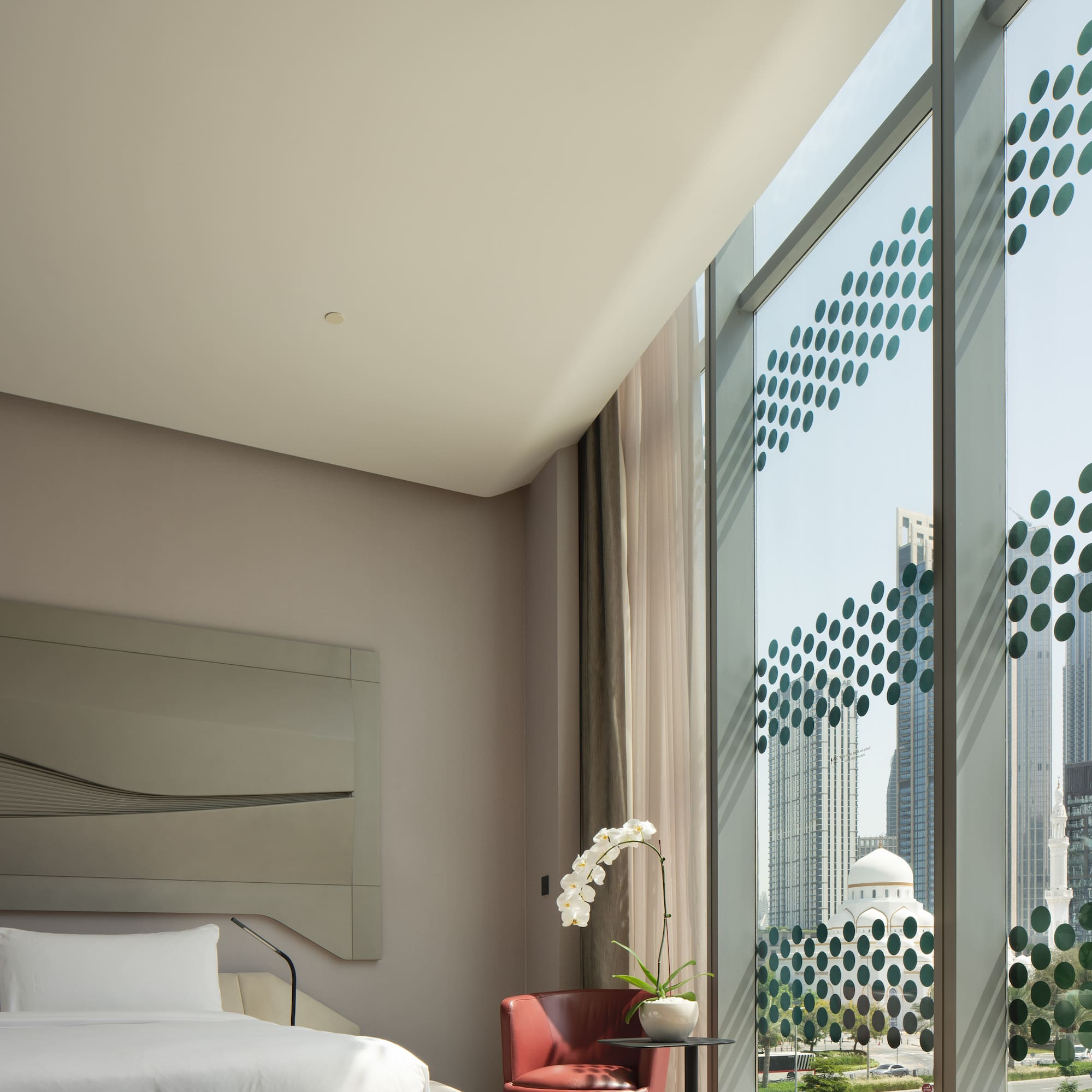 a room with a bed and a chair