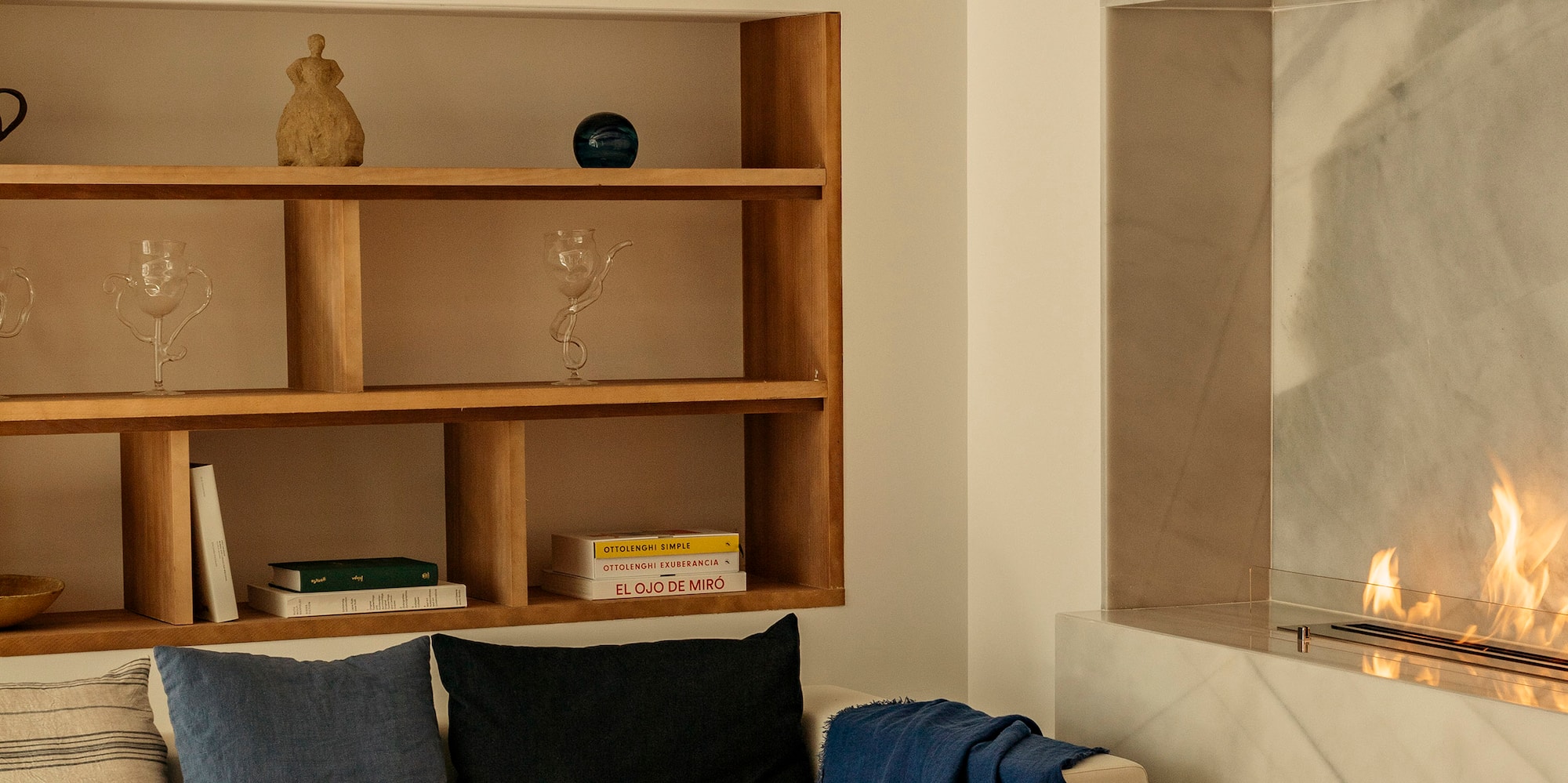 a living room with a fireplace and a couch