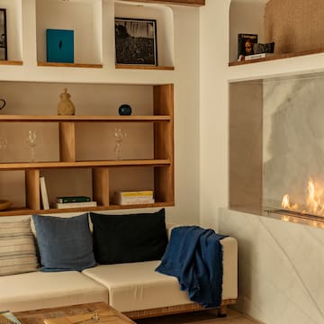 a living room with a fireplace and a couch