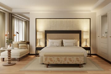 a bedroom with a bed and a bench