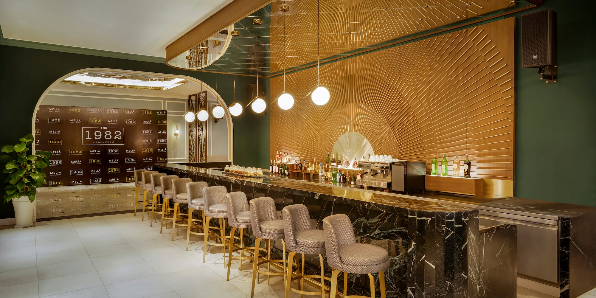 a bar with chairs and lights