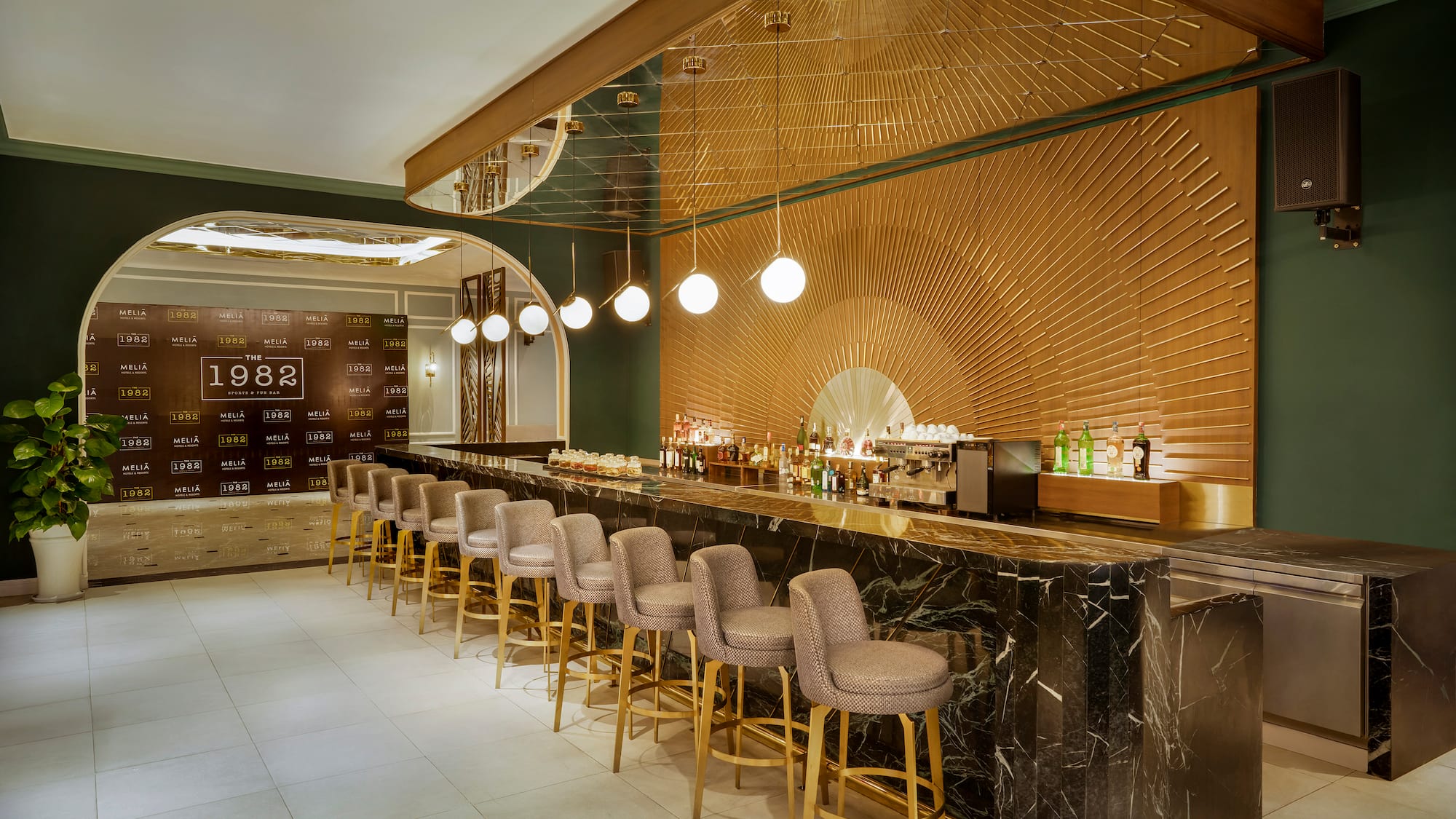 a bar with chairs and lights