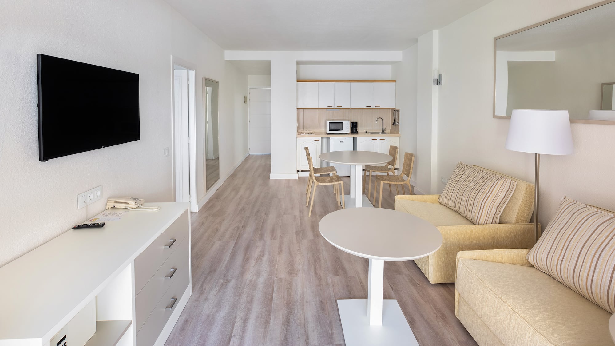 a living room with a tv and couch