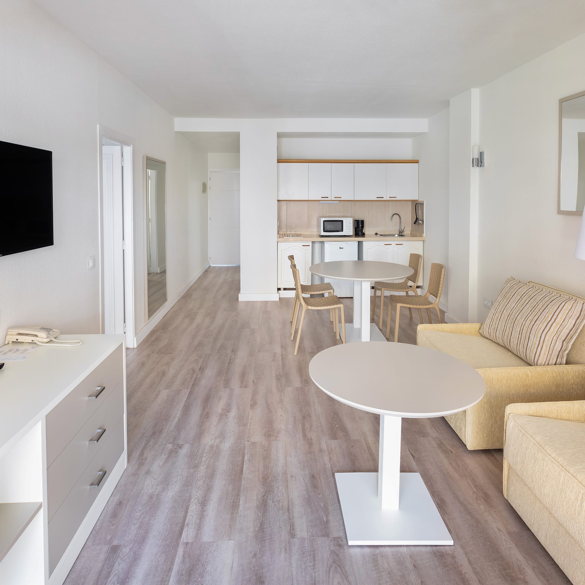 a living room with a tv and couch