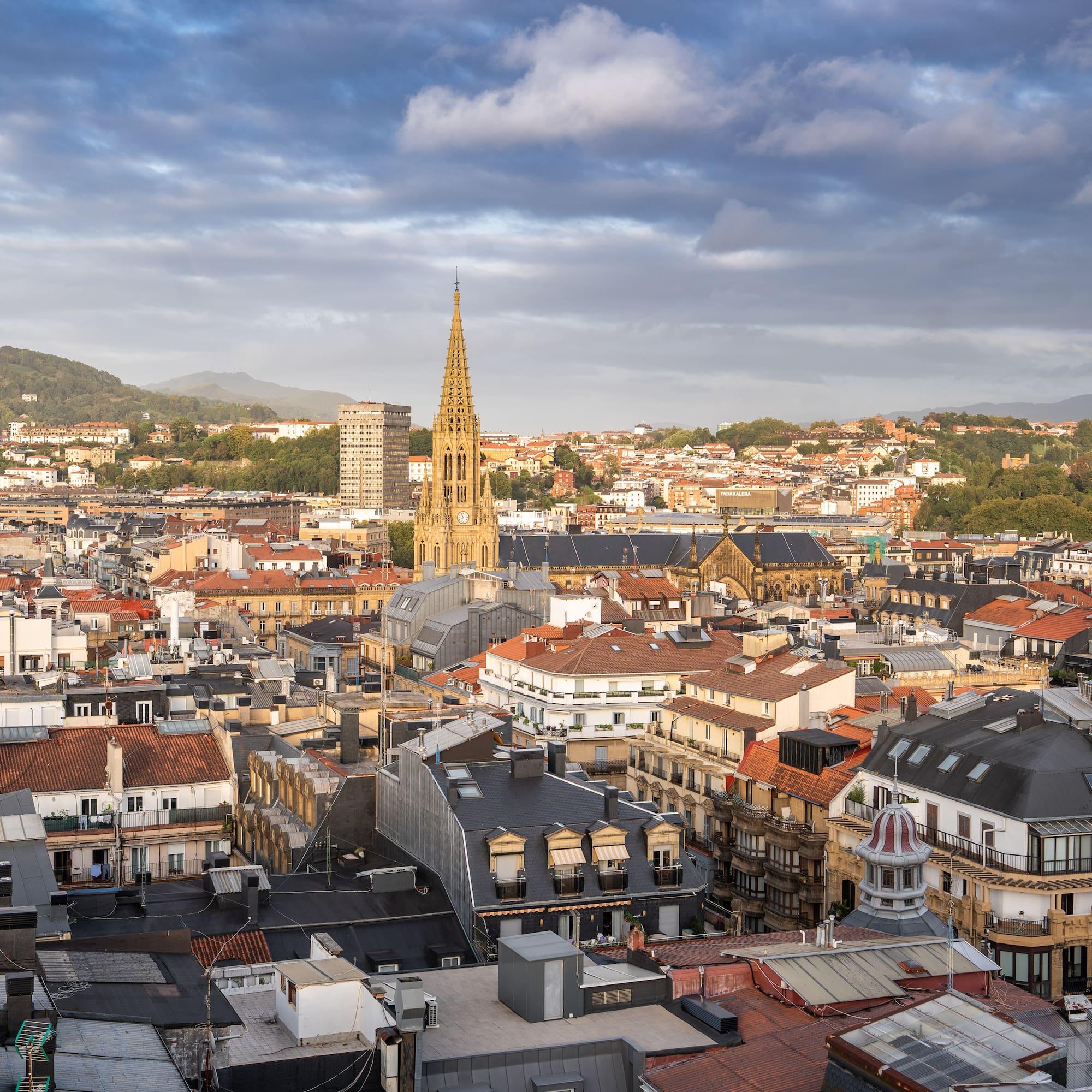 a city with many buildings and a tall tower
